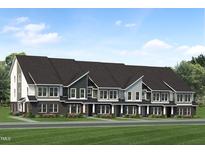 Beautiful new townhomes boast unique curb appeal with craftsman-style architecture and manicured landscaping at 805 Fireship Rd, Fuquay Varina, NC 27526