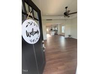 Inviting entryway featuring hardwood floors and an open floor plan leading into the spacious home at 1303 Whitsett St, Burlington, NC 27217