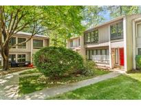Charming townhome with a well-maintained lawn, mature trees, and updated siding at 1782 Quail Ridge Rd, Raleigh, NC 27609