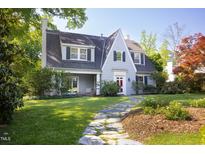 Beautiful exterior elevation showcasing a well-maintained lawn and a traditional home design with classic architectural details at 19 Oak Dr, Durham, NC 27707