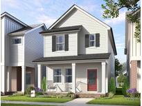 Charming two-story home with a welcoming front porch and landscaped yard at 332 Cottage Hl, Knightdale, NC 27604
