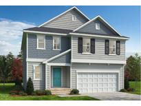 Charming two-story home featuring gray siding, black shutters, a turquoise front door and an attached garage at 368 Spelt Ct, Rolesville, NC 27571