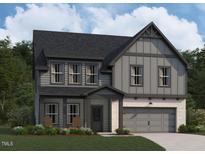 Charming two-story home with gray siding, stone accents, and a welcoming front porch at 4317 Emeline Way # 12, Fuquay Varina, NC 27526