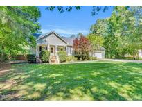 Charming single-story home with a well-manicured lawn and inviting front porch at 76 Bergeson Ct, Fuquay Varina, NC 27526