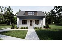Charming craftsman-style home with a welcoming front porch and well-maintained landscaping at 909 Oberlin Rd, Raleigh, NC 27605