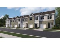 New townhomes with garages and neutral color schemes offer a modern and appealing street presence at 121 N Chubb Rdg, Wilson's Mills, NC 27520