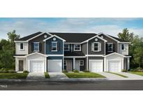 Modern townhome exterior showcasing a private garage and neutral color palette at 2027 Oakdale Dr, Durham, NC 27703