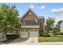 Beautiful two-story brick home with a two-car garage and well-manicured landscaping at 245 Kylemore Cir, Cary, NC 27513