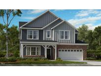 Two-story home featuring a brick garage and siding with white trim at 2625 Stonington Dr, Cary, NC 27523