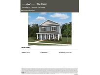 Charming two-story home featuring a symmetrical facade, light blue siding, and a welcoming front porch at 2868 Quarry Rd # 167, Rolesville, NC 27571