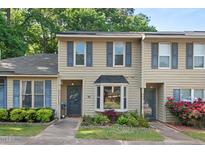 Charming townhome with neutral siding, bay window, and a well-manicured front yard at 35 Stonewall Way, Durham, NC 27704