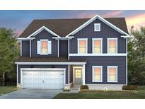 Charming two-story home with blue siding, white trim, and a well-manicured lawn at 413 Providence Springs Ln, Fuquay Varina, NC 27526