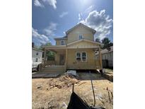 Charming home featuring a covered porch, a classic gable roof, and unfinished landscaping at 618 Price Ave, Durham, NC 27701
