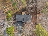 An aerial view of a charming home with mature trees and natural surroundings, offering privacy at 2224 Clements Dr, Durham, NC 27704