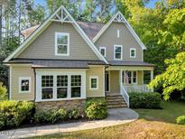 Charming two-story home featuring a welcoming front porch and beautifully landscaped front yard at 3650 Brooks Bnd, Franklinton, NC 27525