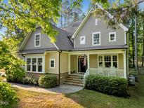 Charming two-story home with a welcoming front porch, well-maintained landscaping, and neutral color palette at 3650 Brooks Bnd, Franklinton, NC 27525