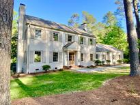 Charming two-story home with shutters, inviting entryway, and well-maintained front yard at 3838 Regent Rd, Durham, NC 27707