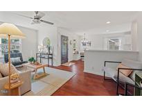 Bright living room featuring hardwood floors, neutral paint, and large windows at 623 Massey Ave, Durham, NC 27701