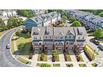 Beautiful townhomes feature landscaped yards and charming exterior design, offering a delightful curb appeal at 710 Samuel Cary Dr, Cary, NC 27511