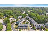 An attractive aerial view of a well-planned residential neighborhood with lush green trees and community spaces at 710 Samuel Cary Dr, Cary, NC 27511