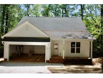 Charming single-story home featuring an attached garage, brick-lined entry steps, and a well-manicured lawn at Lot 3260 Yorkshire Cir, Sanford, NC 27332