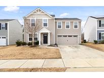 Charming two-story home with attached two car garage and inviting curb appeal at 1012 Old Evergreen Dr, Durham, NC 27704