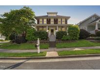 Charming two-story home with landscaped front yard and inviting porch at 112 Homegate Cir, Apex, NC 27502