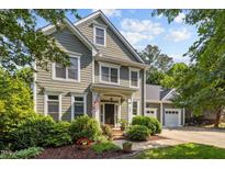 Charming two-story home with an inviting entrance and beautifully landscaped front yard, perfect for curb appeal at 204 Rossburn Way, Chapel Hill, NC 27516