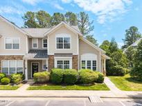 Charming townhouse with neutral siding, stone accents, manicured bushes, and a lovely walkway at 3601 Sugar Tree Pl, Durham, NC 27713