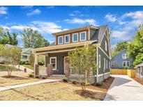 Charming two-story home with landscaped yard and welcoming front porch in a desirable neighborhood at 801 N Elm St, Durham, NC 27701