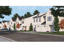 Charming new townhomes feature modern farmhouse design with inviting front lawns and convenient two-car garages at 909 Selby Ave, Durham, NC 27713