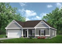 Charming single-Gathering home with a well-manicured lawn and gray and white siding at 445 Olivia Crossing Ct # 22, Four Oaks, NC 27524