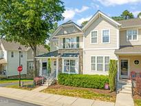 Charming two-story home featuring a stone facade and landscaped front yard, perfect for suburban living at 4703 Kings Garden Rd, Raleigh, NC 27612