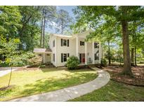 Charming two-story home with classic architectural design, and a beautifully landscaped front yard, perfect for families at 5312 Hallmark Rd, Durham, NC 27712