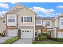 Charming townhome with a well-manicured lawn, attached garage, and beautiful landscaping at 5912 Hourglass Ct, Raleigh, NC 27612