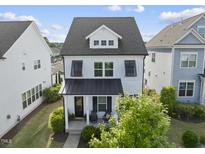 Charming two-story home features a welcoming porch and well-maintained landscaping at 1616 Silo Ridge Dr, Wake Forest, NC 27587
