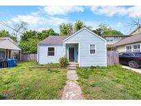 Charming blue one-story home with a neatly landscaped front yard and inviting entrance at 212 Northwood Cir, Durham, NC 27701