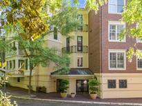 Attractive multi-story condo building with a mix of brick and stucco exterior finishes and inviting entryway at 2701 Glenwood Gardens Ln, Raleigh, NC 27608