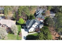 Aerial shot of a two-story home with a driveway and well-maintained landscaping at 325 Hogans Valley Way, Cary, NC 27513