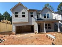 New construction home with gray siding, double windows, and an attached two-car garage ready to be completed at 436 Golden Dragonfly St, Wake Forest, NC 27587