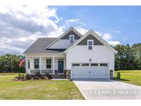 Charming two-story home features a welcoming porch, two-car garage, and a well-manicured lawn at 440 Golden Dragonfly St, Wake Forest, NC 27587