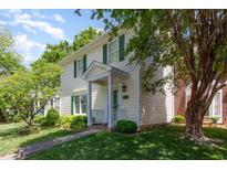Charming two-story home with green shutters and a well-maintained lawn and a small front porch at 6922 Saxby Ct, Raleigh, NC 27613