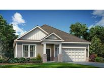 Charming single-story home featuring a two-car garage and craftsman-style details, set against a bright blue sky at 1033 Channel Drop Lp, Zebulon, NC 27597