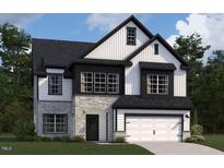 Charming two-story home with stone accents, white siding, and a neatly manicured lawn at 109 Moonflower Ln # Homesite 260, Wilson's Mills, NC 27520