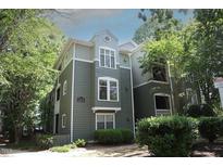 Charming condo with neutral colors and lovely surrounding landscaping with green trees at 1211 Westview Ln # 201, Raleigh, NC 27605