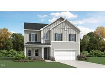 Charming two-story home featuring gray siding, black shutters, and a well-manicured lawn at 1602 Red Roses Way, Durham, NC 27703
