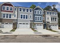 Charming townhomes with individual garages, lovely colors, and inviting curb appeal at 2207 Lambert Rd # 69, Cary, NC 27519