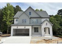 New two-story home features a painted brick facade, attached garage, and professionally landscaped yard at 2408 Eagle Shot Ct # 4, Fuquay Varina, NC 27526