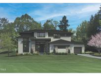 Stunning two-story home with a modern design and a well-manicured lawn, perfect for families at 7652 Falls Creek Ln, Raleigh, NC 27614