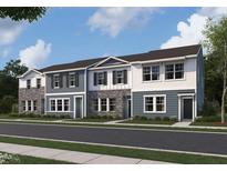Charming townhome exterior showcasing a blend of textures and colors with well-manicured landscaping at 2109 Glen Crossing Dr, Durham, NC 27704